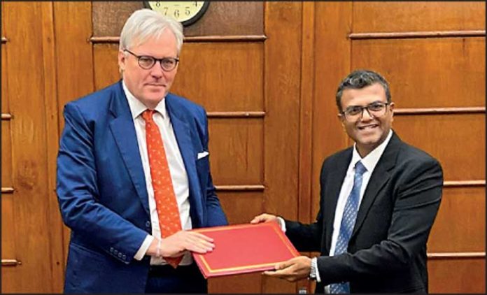 British High Commissioner Andrew Patrick (left) and Finance Secretary Dr. Harshana Suriyapperuma